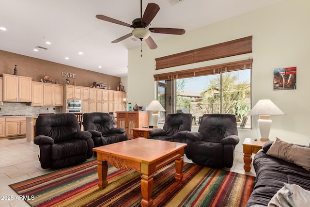 living area featuring recessed lighting, visible vents, and light tile patterned flooring