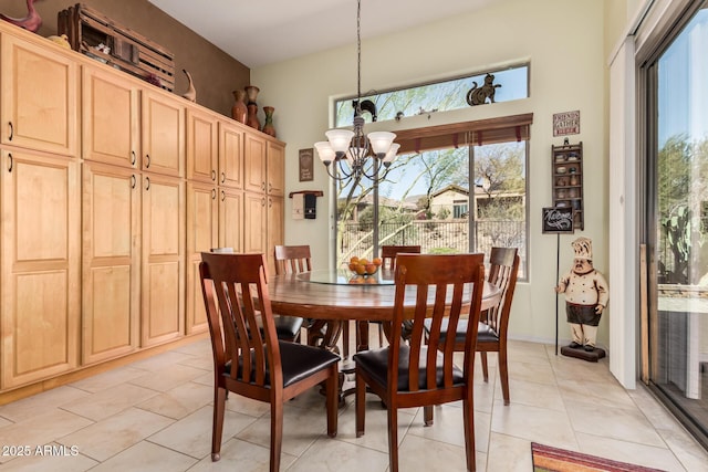 dining area featuring light tile patterned floors and a notable chandelier