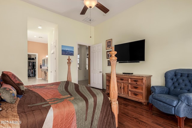 bedroom with wood finished floors, visible vents, and a ceiling fan