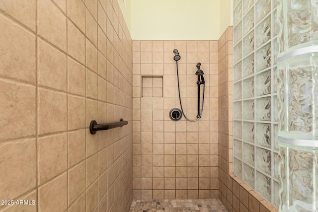 full bath featuring a tile shower