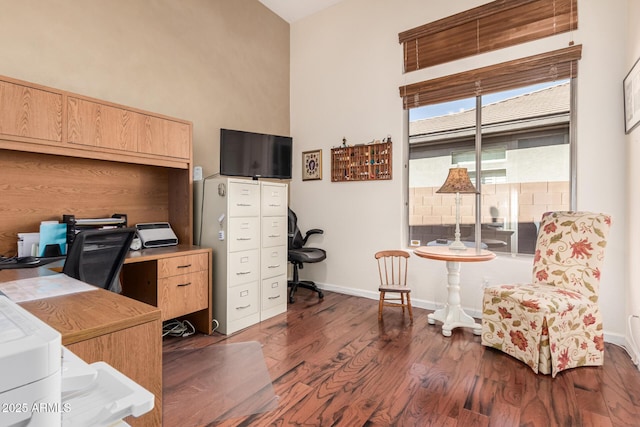 home office with wood finished floors and baseboards