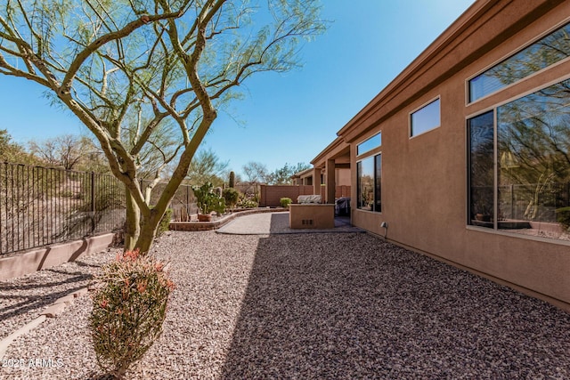 view of yard with a fenced backyard and a patio