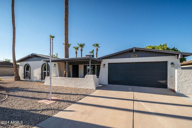 single story home featuring a garage