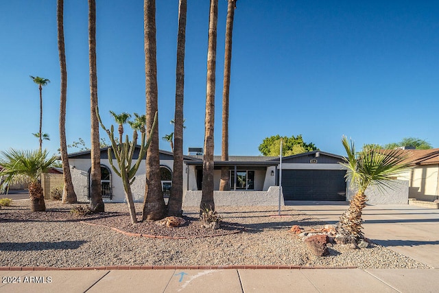 single story home featuring a garage