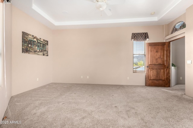 10657 E Cloudview Ave, Gold Canyon, AZ 85118 - unfurnished room with a raised ceiling, a ceiling fan, and carpet flooring