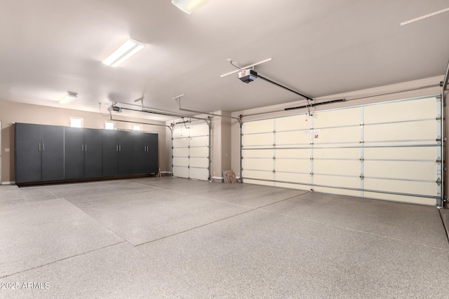 10657 E Cloudview Ave, Gold Canyon, AZ 85118 - garage featuring baseboards and a garage door opener