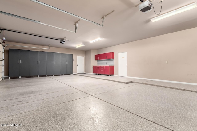 10657 E Cloudview Ave, Gold Canyon, AZ 85118 - garage featuring baseboards and a garage door opener