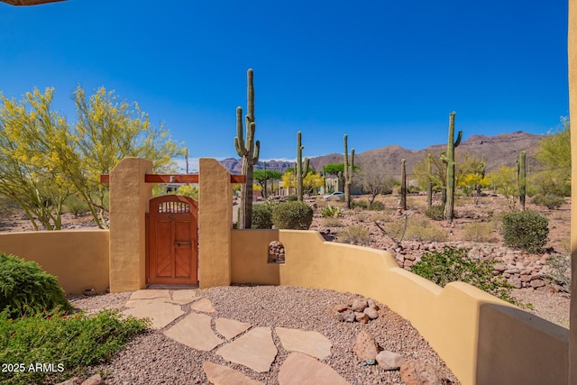 10657 E Cloudview Ave, Gold Canyon, AZ 85118 - exterior space featuring a gate, a mountain view, and a fenced front yard