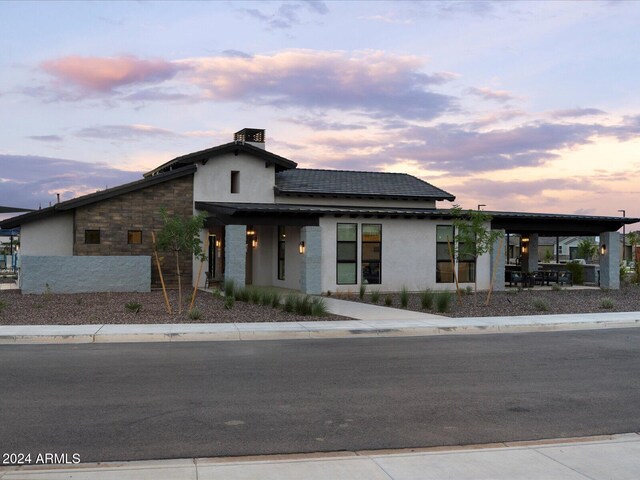 view of front of house featuring solar panels