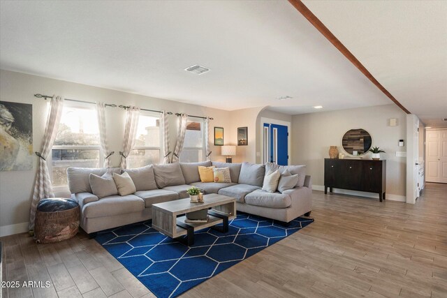 living room with wood finished floors and baseboards