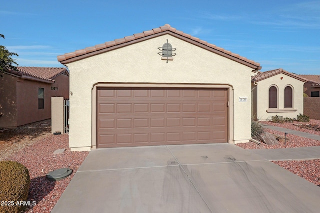 mediterranean / spanish house featuring a garage