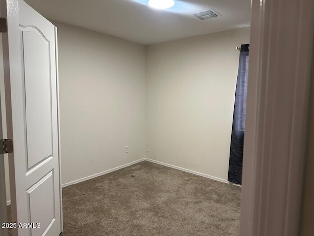 spare room featuring carpet