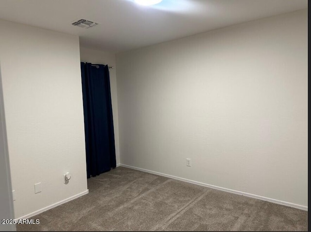 spare room featuring carpet floors