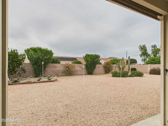 view of yard with a fenced backyard