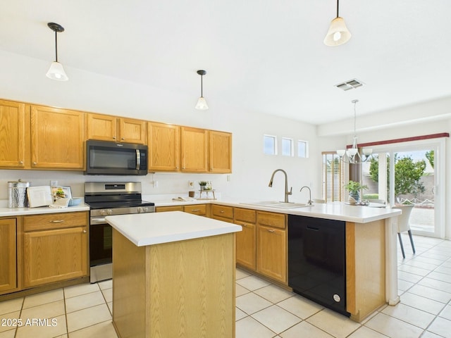 kitchen with visible vents, dishwasher, a peninsula, stainless steel range with electric cooktop, and a sink