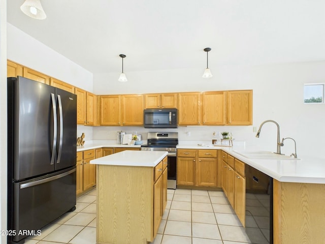 kitchen featuring light tile patterned floors, a peninsula, stainless steel appliances, light countertops, and a sink