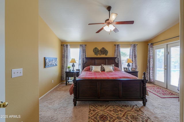 bedroom with access to exterior, ceiling fan, lofted ceiling, light carpet, and french doors