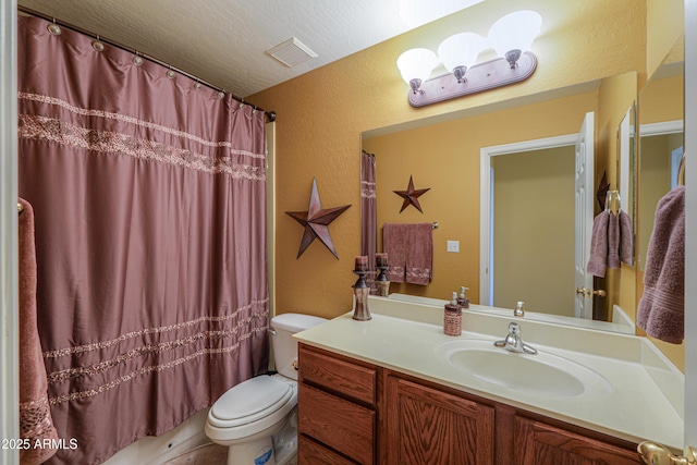 full bath with visible vents, toilet, a textured ceiling, vanity, and a textured wall