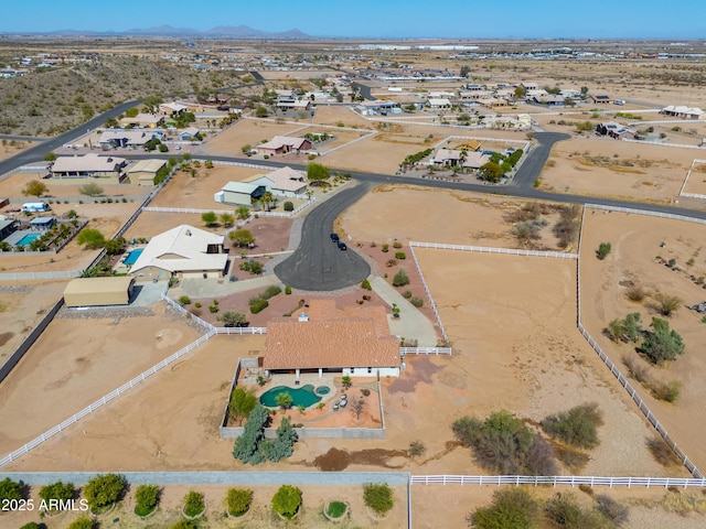 aerial view featuring a mountain view and a desert view