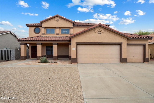 10551 W Jessie Ln, Peoria, AZ 85383 - mediterranean / spanish house with stucco siding, an attached garage, a tiled roof, driveway, and a porch