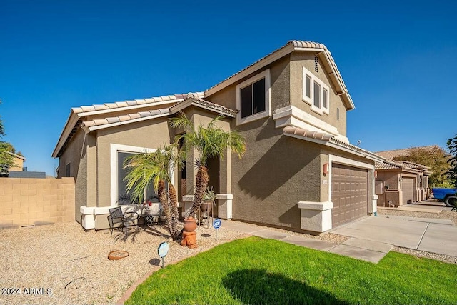 view of front of home with a garage