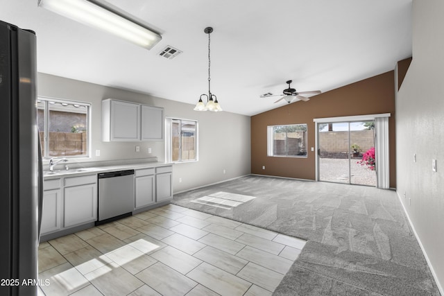 6410 W Winslow Ave, Phoenix, AZ 85043 - kitchen with stainless steel dishwasher, freestanding refrigerator, a chandelier, lofted ceiling, and ceiling fan