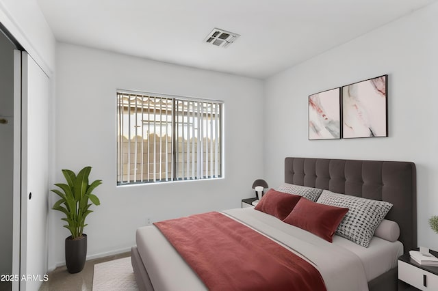 6410 W Winslow Ave, Phoenix, AZ 85043 - bedroom with baseboards, carpet floors, and a closet