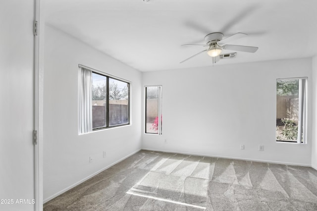 6410 W Winslow Ave, Phoenix, AZ 85043 - carpeted empty room with healthy amount of natural light, ceiling fan, and baseboards