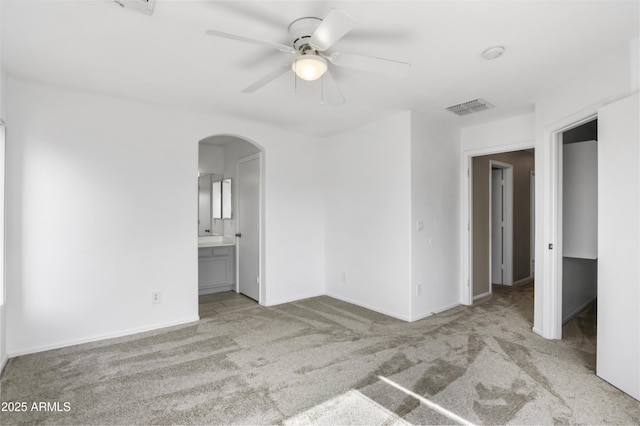 6410 W Winslow Ave, Phoenix, AZ 85043 - carpeted empty room featuring arched walkways, a ceiling fan, and baseboards