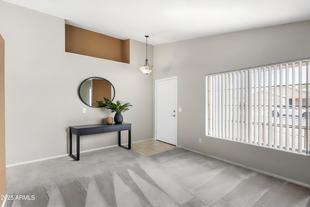 6410 W Winslow Ave, Phoenix, AZ 85043 - entrance foyer with carpet floors, baseboards, and a towering ceiling