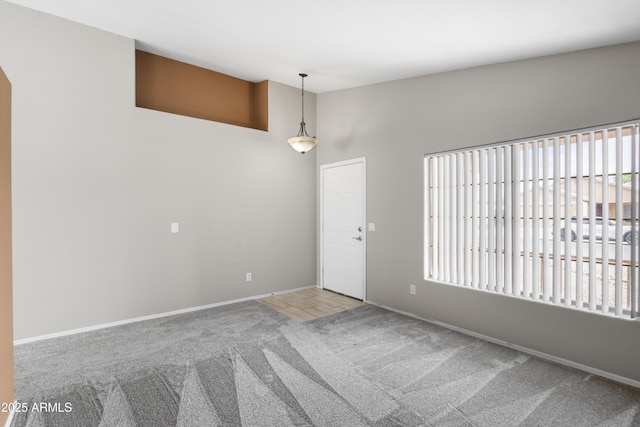 6410 W Winslow Ave, Phoenix, AZ 85043 - spare room with carpet flooring, baseboards, and vaulted ceiling