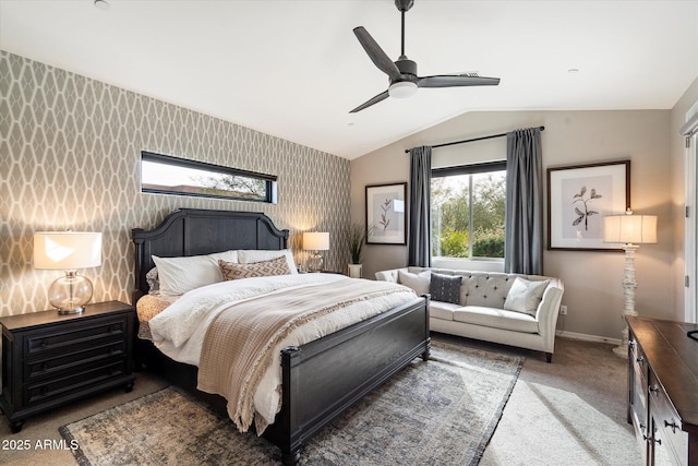 carpeted bedroom featuring ceiling fan and vaulted ceiling