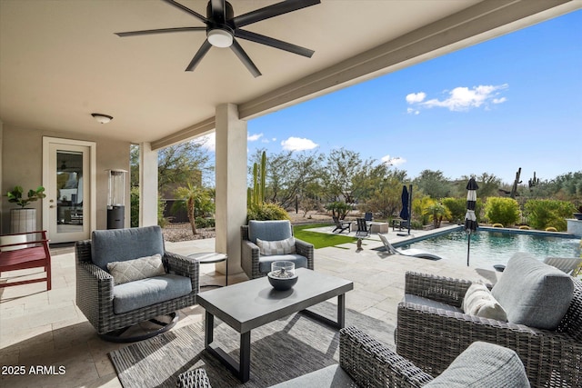 view of patio / terrace featuring pool water feature, ceiling fan, and an outdoor hangout area