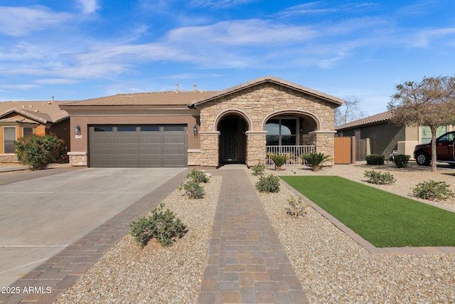 view of front facade featuring a garage and covered porch