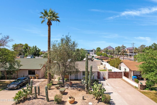 1940 E Indianola Ave E, Phoenix, AZ 85016 - view of front of house with concrete driveway, a residential view, and a gate