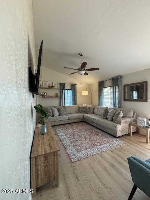 1940 E Indianola Ave E, Phoenix, AZ 85016 - living room with ceiling fan, wood finished floors, and lofted ceiling