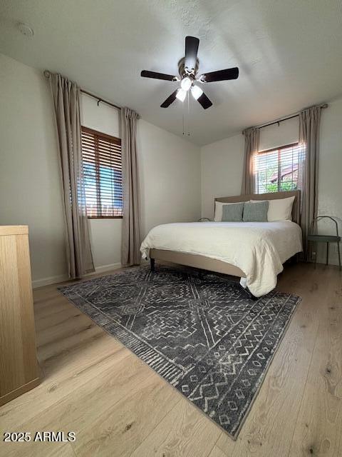 1940 E Indianola Ave E, Phoenix, AZ 85016 - bedroom featuring wood finished floors and a ceiling fan