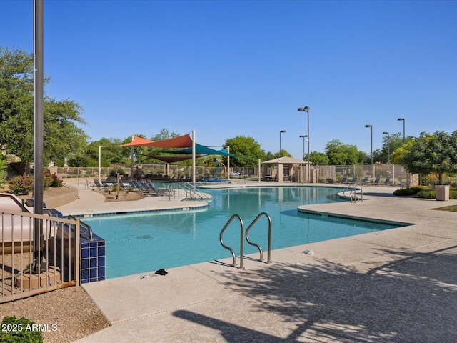 view of swimming pool featuring a patio