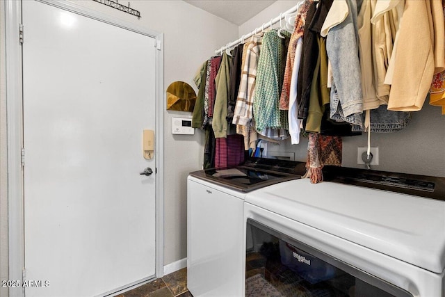 interior space featuring stone finish flooring and independent washer and dryer