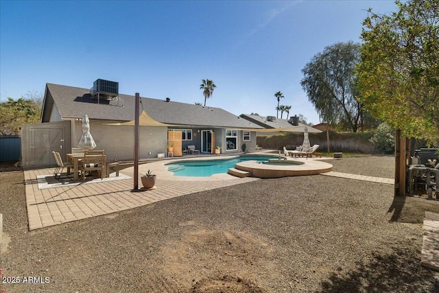 view of pool featuring a fenced in pool, fence, central AC, and a patio