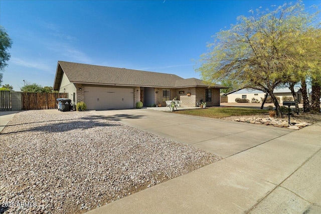 ranch-style house with driveway, a garage, fence, and brick siding