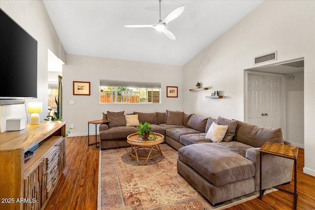 living area featuring ceiling fan, wood finished floors, visible vents, and baseboards