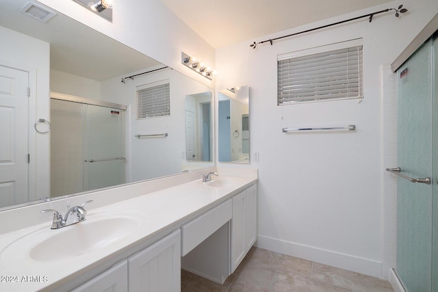 3956 N 151st Dr, Goodyear, AZ 85395 - full bathroom with double vanity, a shower stall, and tile patterned flooring