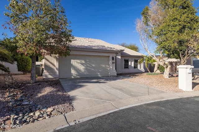 3956 N 151st Dr, Goodyear, AZ 85395 - single story home featuring a garage, a tiled roof, concrete driveway, and stucco siding