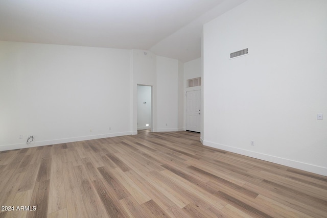 3956 N 151st Dr, Goodyear, AZ 85395 - spare room with light wood-style floors and high vaulted ceiling
