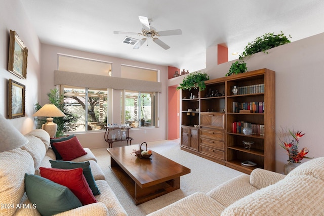 carpeted living room featuring ceiling fan