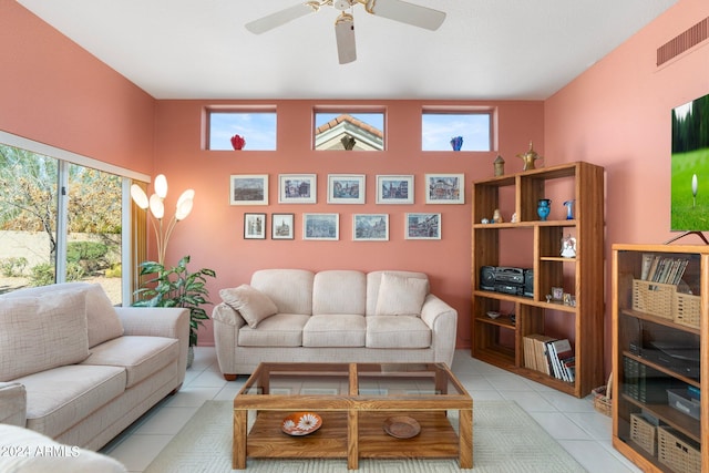 living room featuring ceiling fan and light tile patterned floors