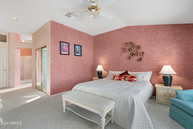 carpeted bedroom with ceiling fan and vaulted ceiling