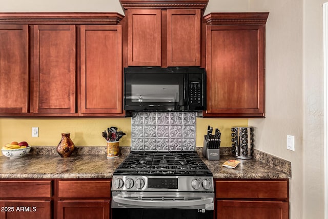 kitchen featuring reddish brown cabinets, dark countertops, black microwave, and stainless steel gas range oven