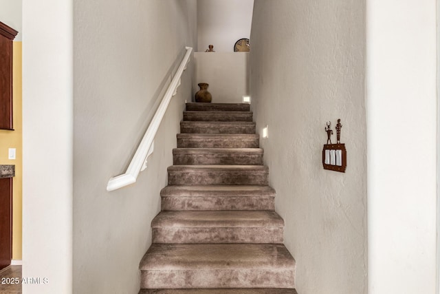 stairs with a textured wall